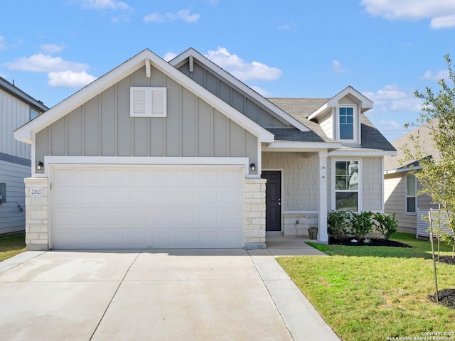 view of front of house with a garage and a front lawn