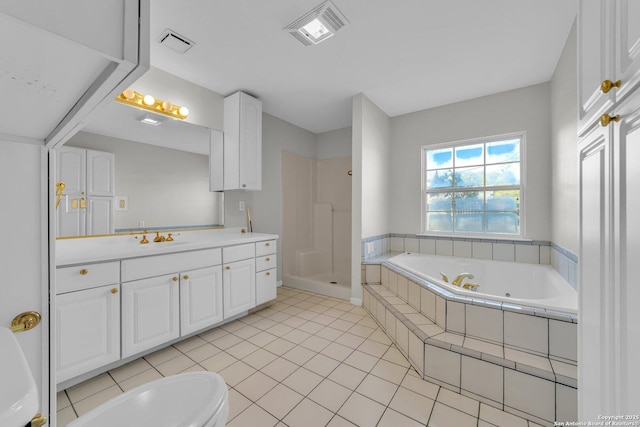 bathroom featuring tile patterned floors, plus walk in shower, and vanity