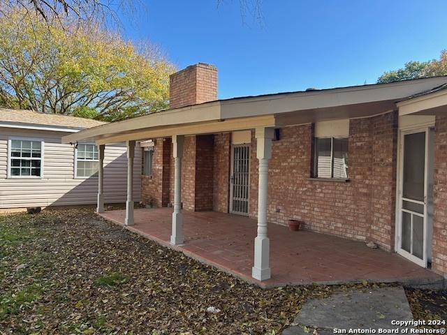 rear view of property featuring a patio