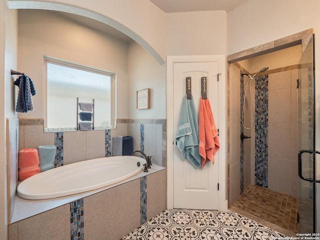 bathroom with plus walk in shower and tile patterned floors