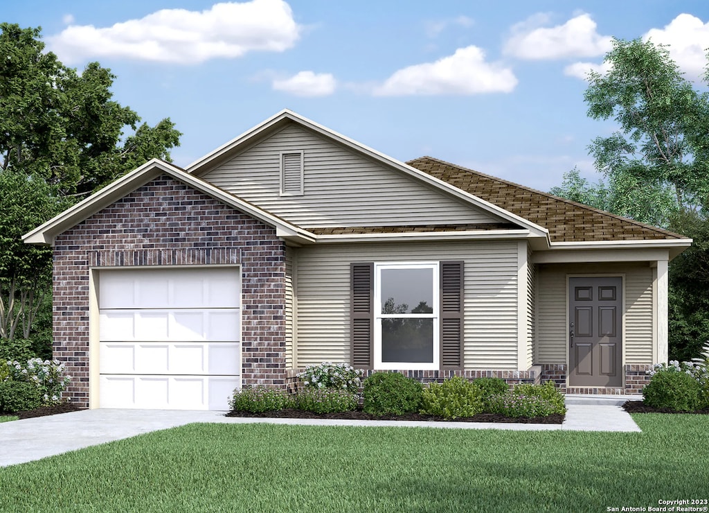 view of front facade with a front yard and a garage