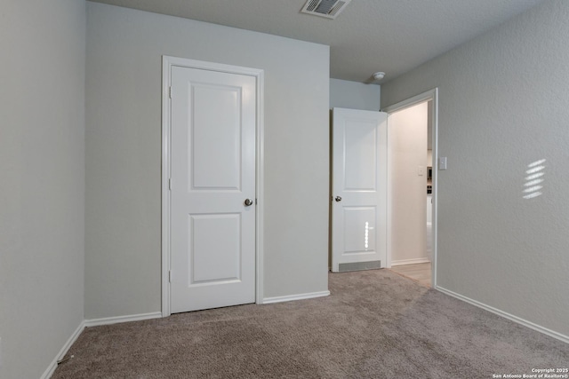 unfurnished bedroom featuring light colored carpet