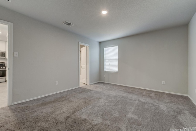 unfurnished room with light carpet