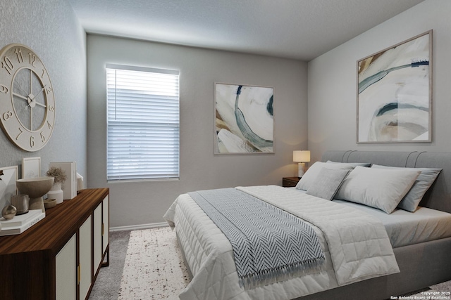 bedroom with light colored carpet