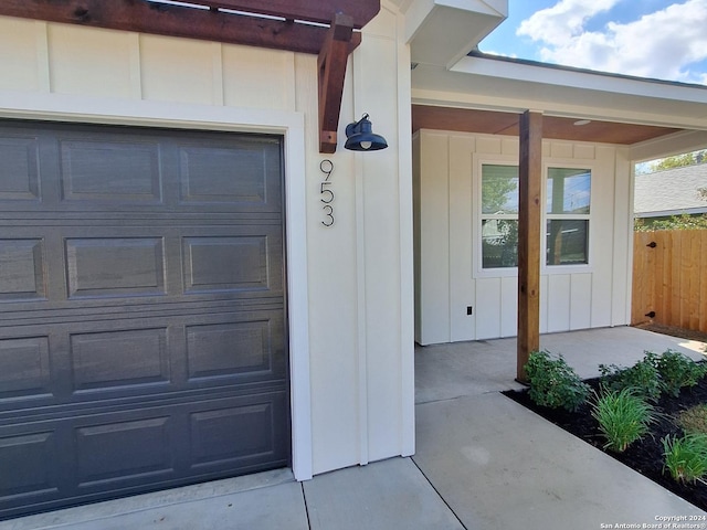 view of exterior entry featuring a garage