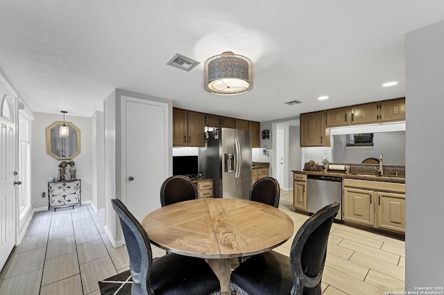 dining room featuring sink