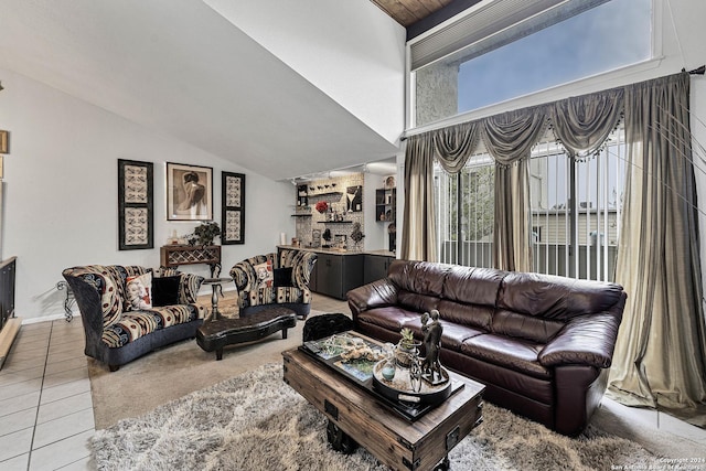 tiled living room featuring lofted ceiling