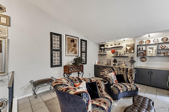 living room with light tile patterned floors and lofted ceiling