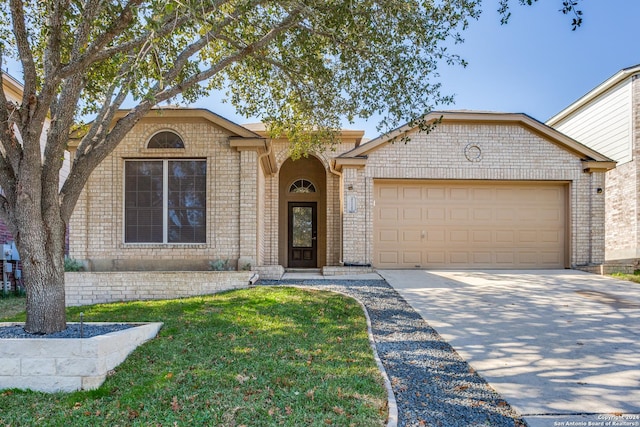 ranch-style house with a front lawn and a garage