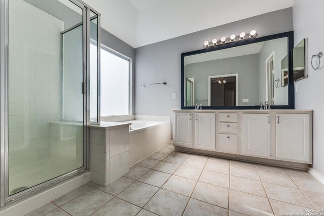 bathroom with tile patterned flooring, vanity, ceiling fan, and plus walk in shower