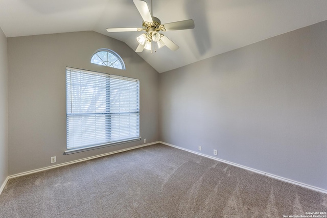 unfurnished room with ceiling fan, carpet floors, and vaulted ceiling