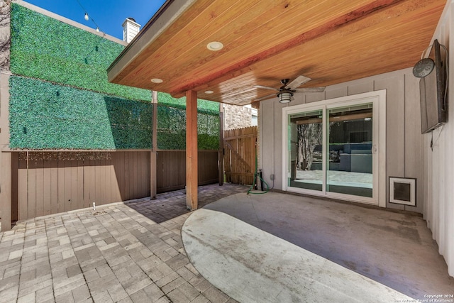 view of patio featuring ceiling fan