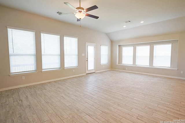 unfurnished living room with ceiling fan, light hardwood / wood-style floors, and vaulted ceiling