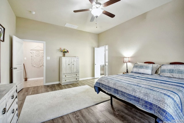 bedroom with ceiling fan and light hardwood / wood-style floors