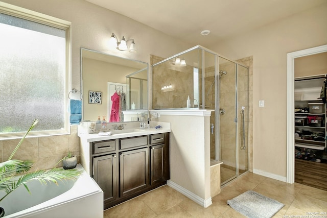 bathroom featuring tile patterned flooring, vanity, and independent shower and bath