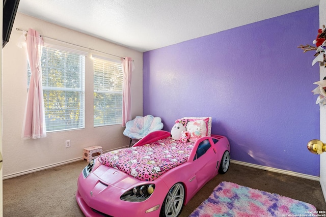 bedroom featuring dark colored carpet