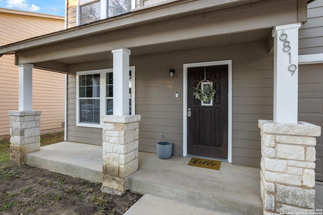 doorway to property with a porch