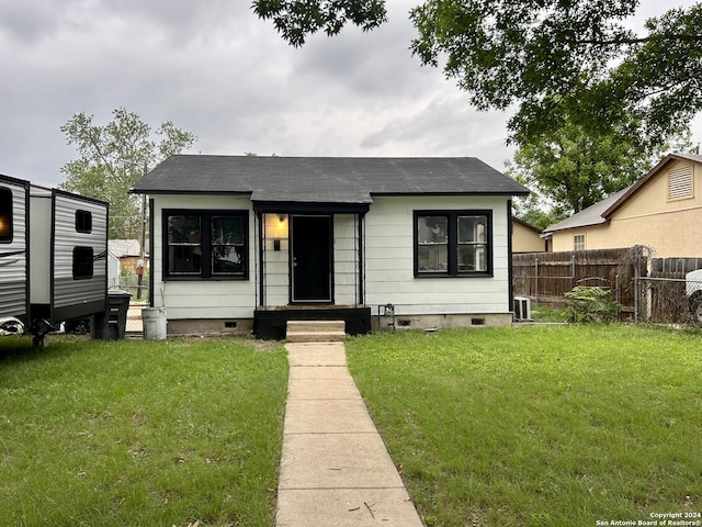 bungalow-style house featuring a front yard