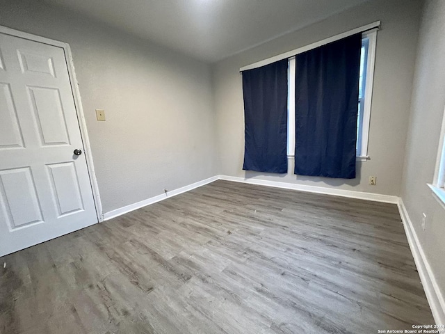 unfurnished room featuring hardwood / wood-style floors