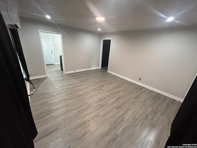 unfurnished room featuring hardwood / wood-style flooring