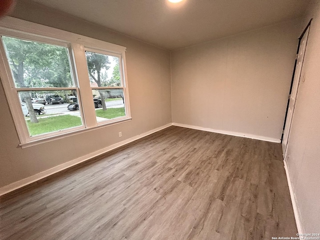 empty room with hardwood / wood-style floors