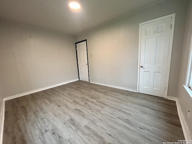 unfurnished room with light wood-type flooring