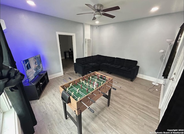 interior space featuring hardwood / wood-style floors and ceiling fan