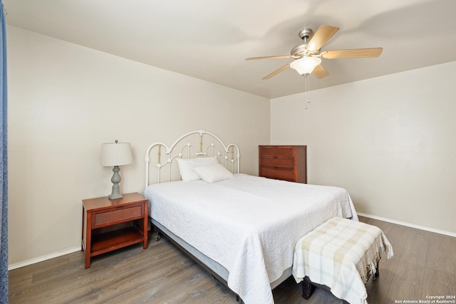 bedroom featuring ceiling fan and hardwood / wood-style flooring