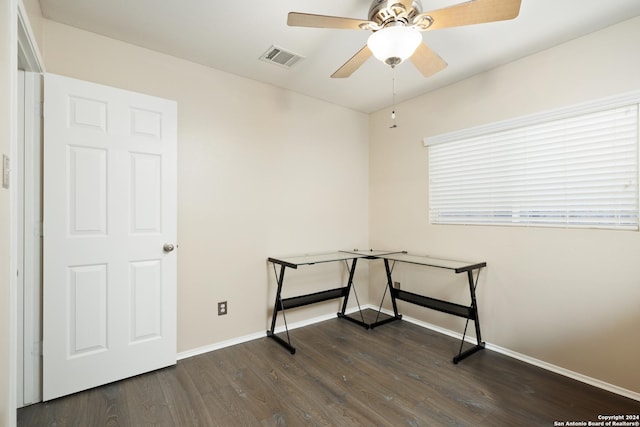 interior space featuring ceiling fan and dark wood-type flooring