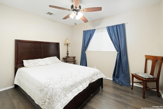 bedroom featuring ceiling fan and dark wood-type flooring