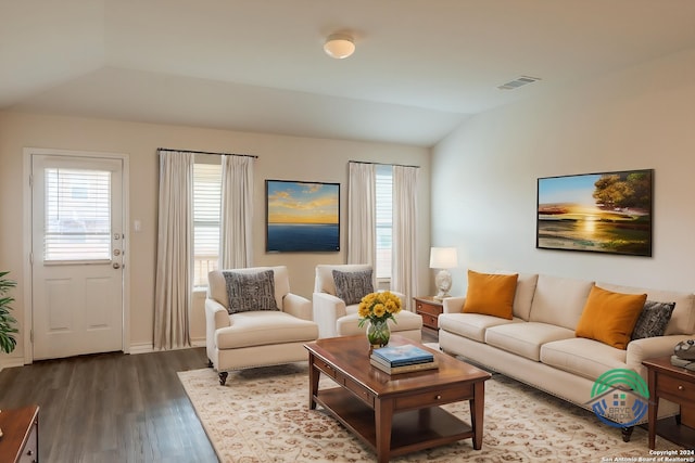 living room with lofted ceiling and hardwood / wood-style flooring