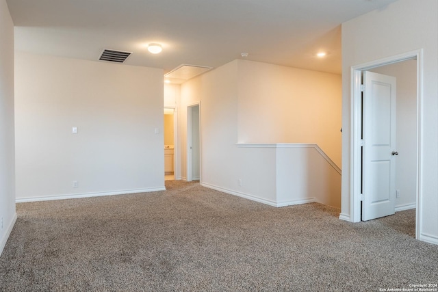 empty room with carpet flooring