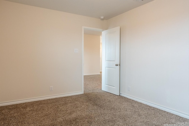 unfurnished room featuring carpet floors