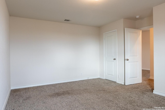 unfurnished bedroom with carpet