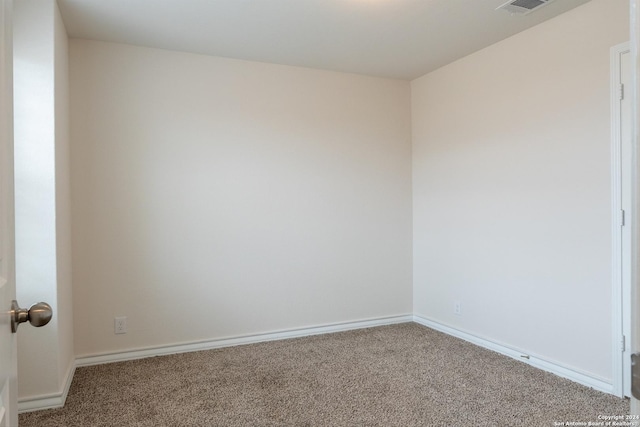 spare room featuring carpet floors