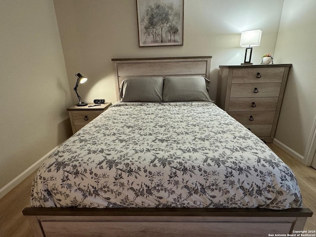 bedroom with light wood-type flooring