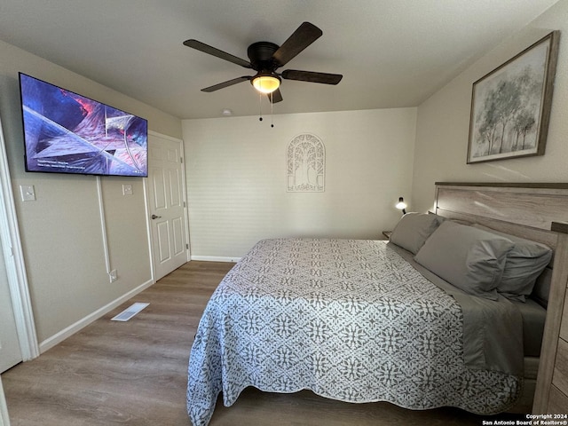 bedroom featuring ceiling fan and wood-type flooring