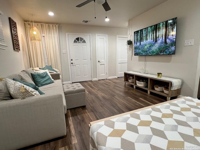 interior space featuring ceiling fan and dark hardwood / wood-style flooring