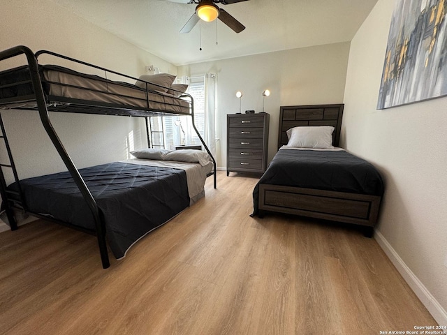 bedroom featuring ceiling fan and light hardwood / wood-style floors