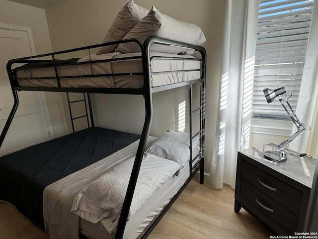 bedroom with light hardwood / wood-style floors