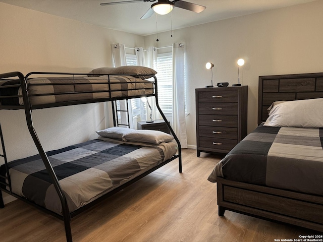 bedroom featuring ceiling fan and light hardwood / wood-style floors