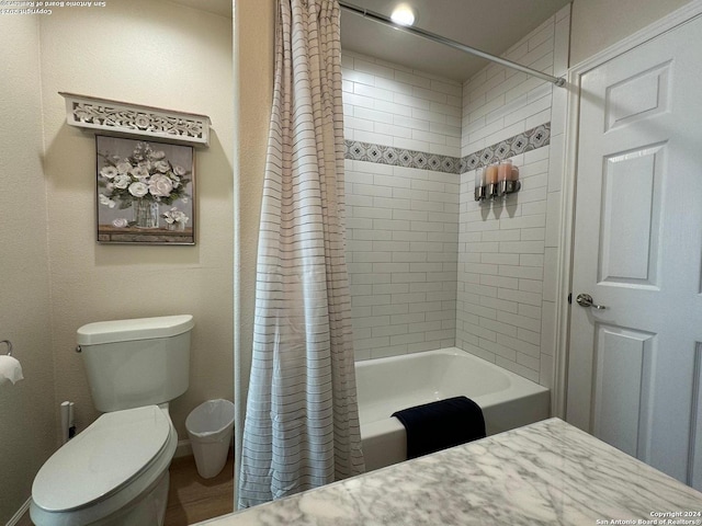 bathroom with shower / bath combo and toilet