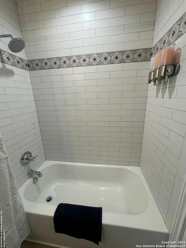 bathroom with shower / tub combo with curtain