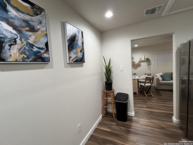 hallway featuring dark hardwood / wood-style flooring