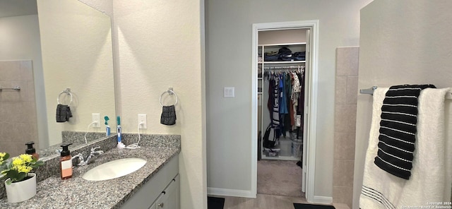 bathroom featuring vanity and wood-type flooring