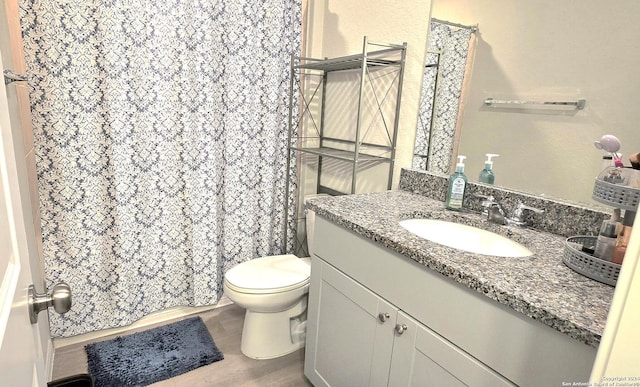 bathroom featuring hardwood / wood-style flooring, vanity, and toilet