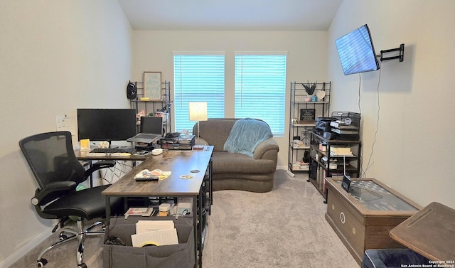 carpeted office featuring lofted ceiling