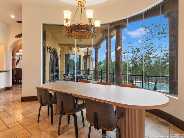 dining space with a notable chandelier