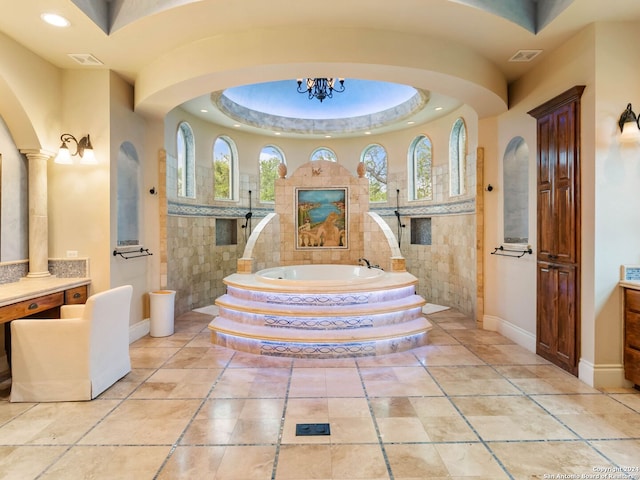 bathroom with vanity, a healthy amount of sunlight, and shower with separate bathtub