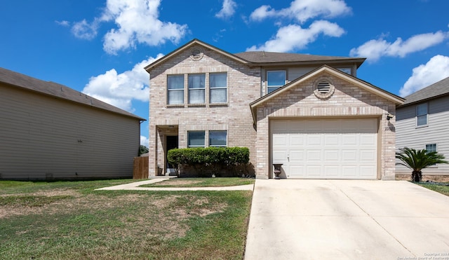 view of front property featuring a front lawn and a garage